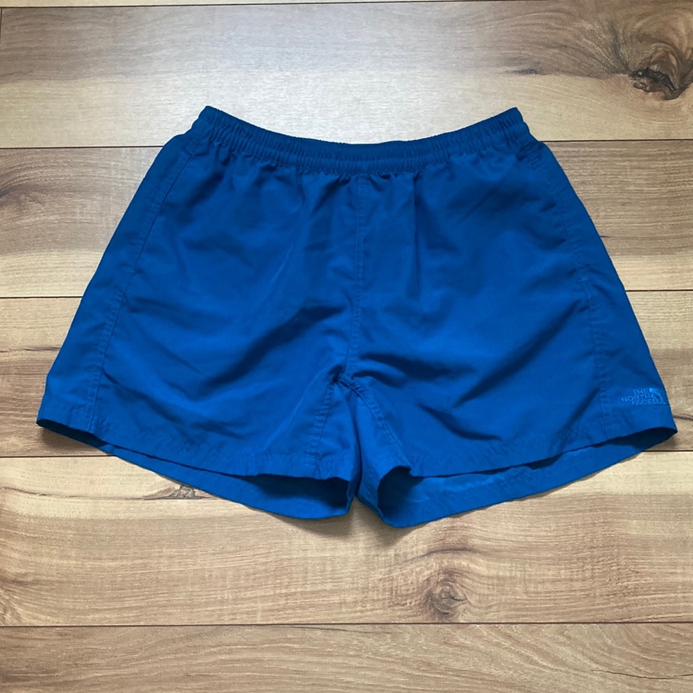 - The North Face Arsa teal athletic shorts. Size M